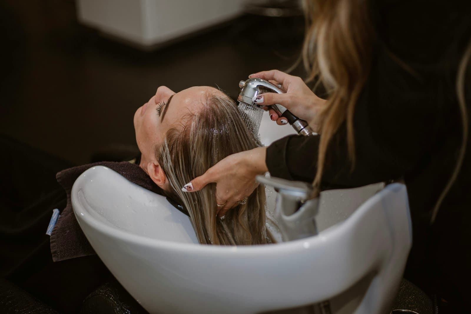 Hair stylist at work in a bright modern salon